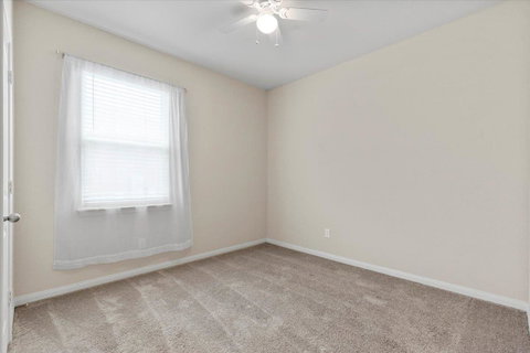 Spare room with light colored carpet and ceiling 