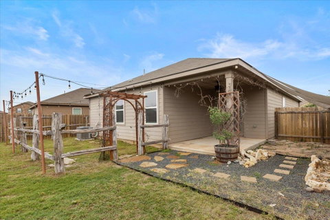 Back of house featuring a fenced backyard and a p