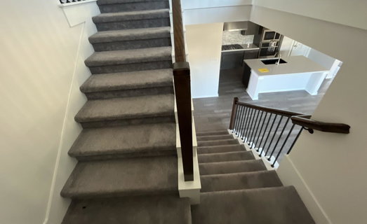 Stairs featuring baseboards and wood finished flo